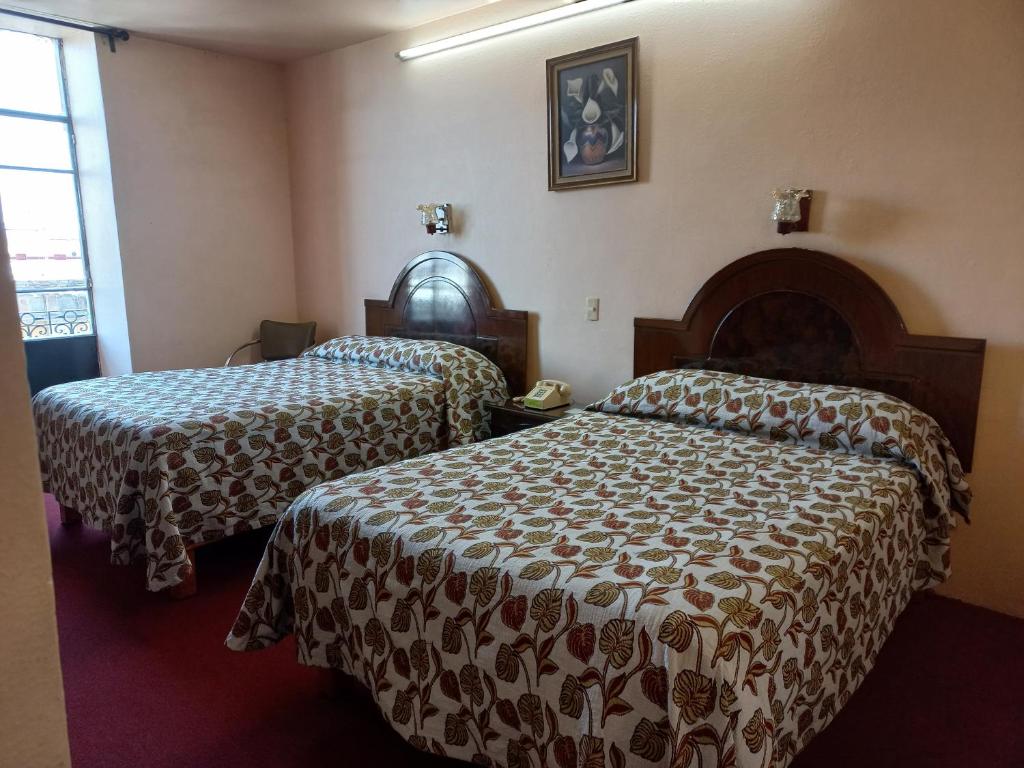Postel nebo postele na pokoji v ubytování Hotel Gomez de Celaya