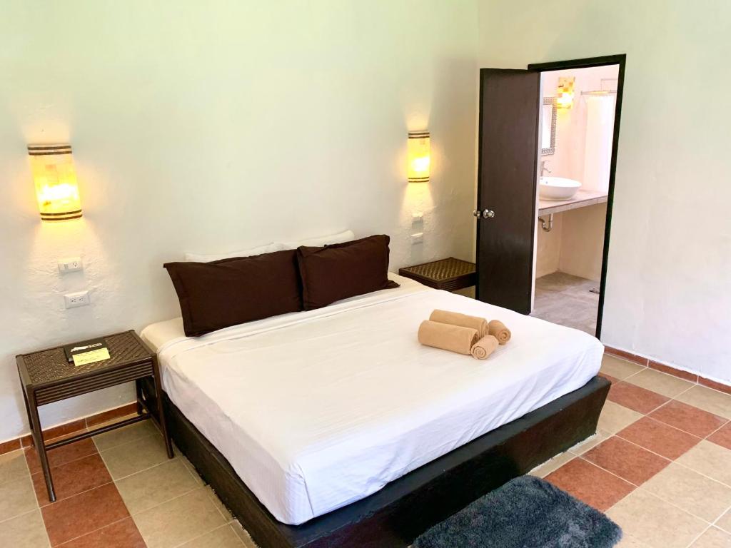 Postel nebo postele na pokoji v ubytování Hotel Green River