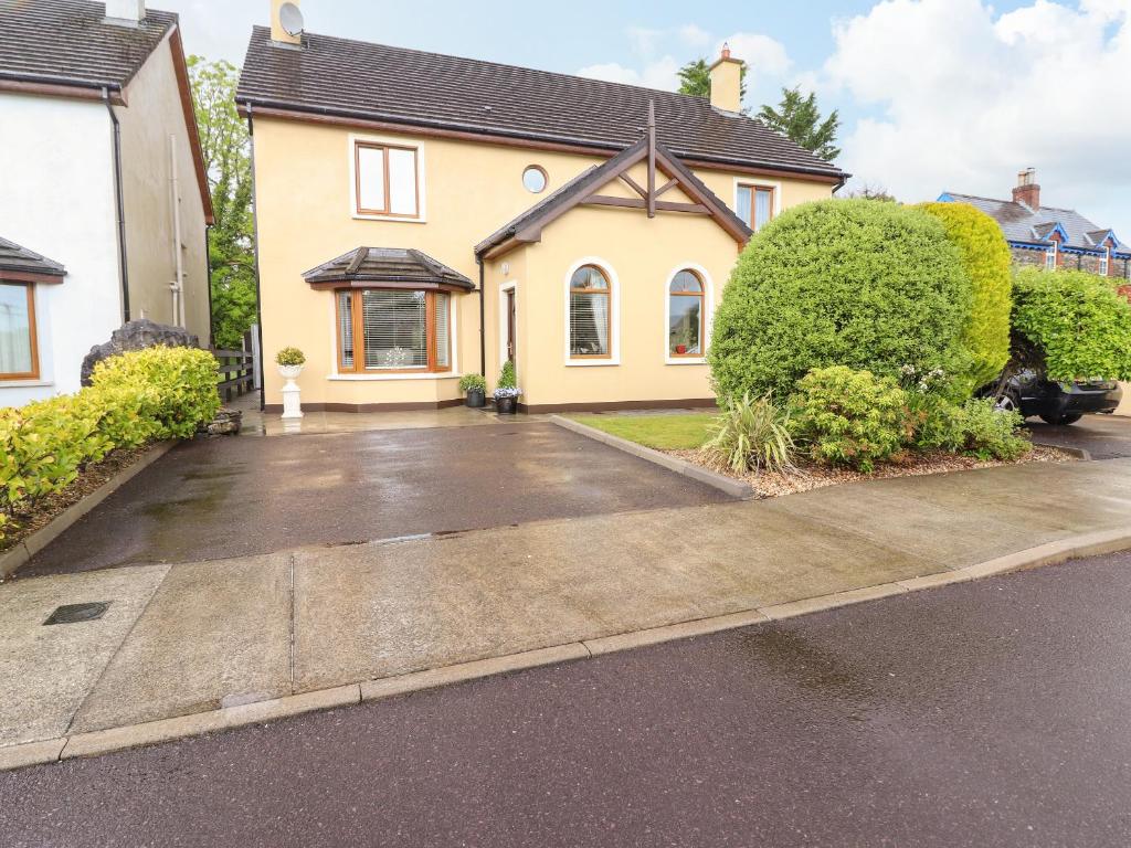 a house with a driveway in front of it at Millfield in Kenmare