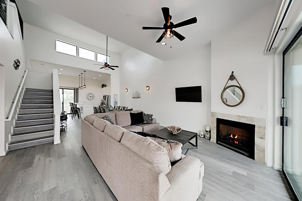 a living room with a couch and a fireplace at Barefoot Wishes in Oceano