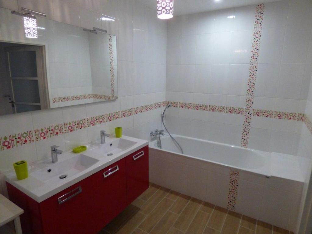 a bathroom with a white tub and a white sink and a bath tub at Gîte Le Bernard, 6 pièces, 10 personnes - FR-1-426-164 in Le Bernard
