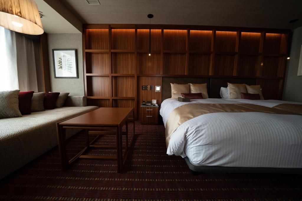 Postel nebo postele na pokoji v ubytování Hotel Grand View Takasaki