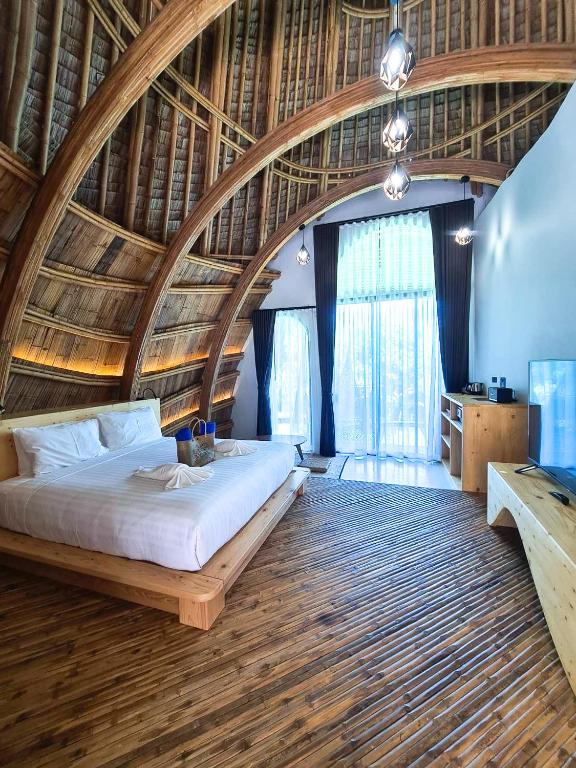 Postel nebo postele na pokoji v ubytování Binlha Raft Resort