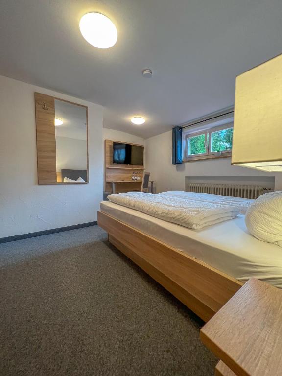 Postel nebo postele na pokoji v ubytování Mountain Hostel City