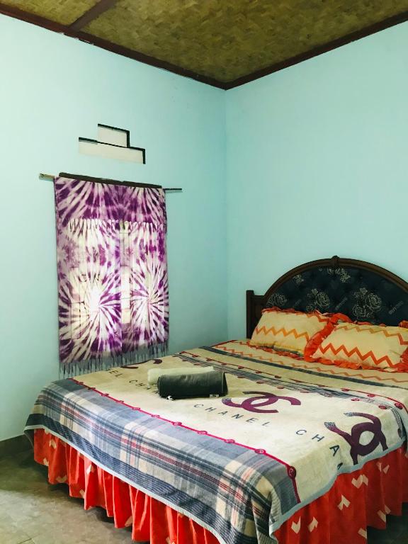 Postel nebo postele na pokoji v ubytování Sawe Homestay