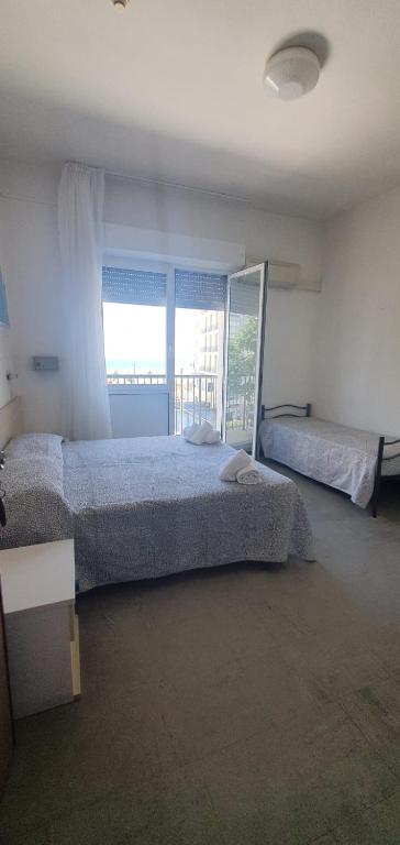 Postel nebo postele na pokoji v ubytování HOTEL VENUS