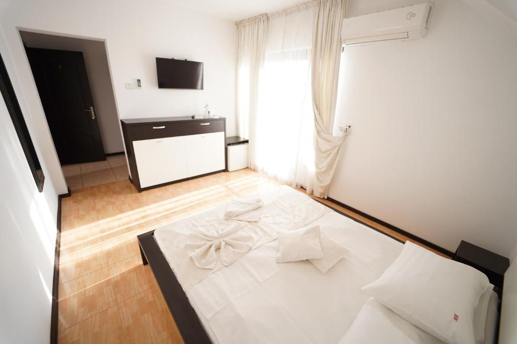 Postel nebo postele na pokoji v ubytování Complex Marinn Costinesti