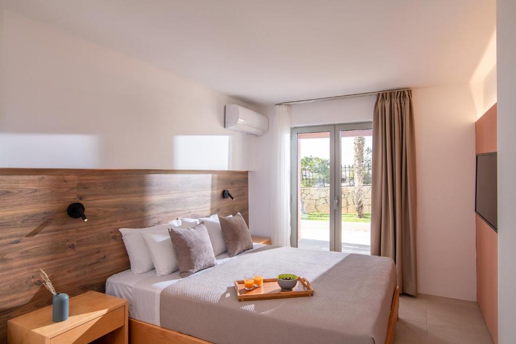 Postel nebo postele na pokoji v ubytování Ariadni Apartments