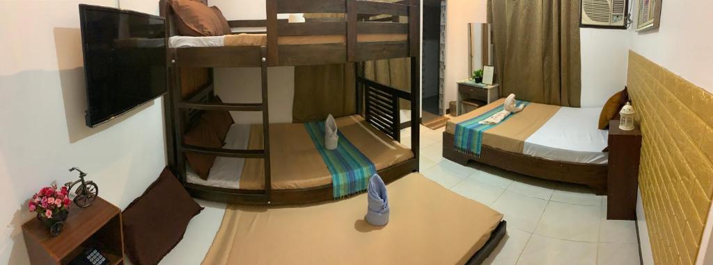 Postel nebo postele na pokoji v ubytování Prim Travellers Inn