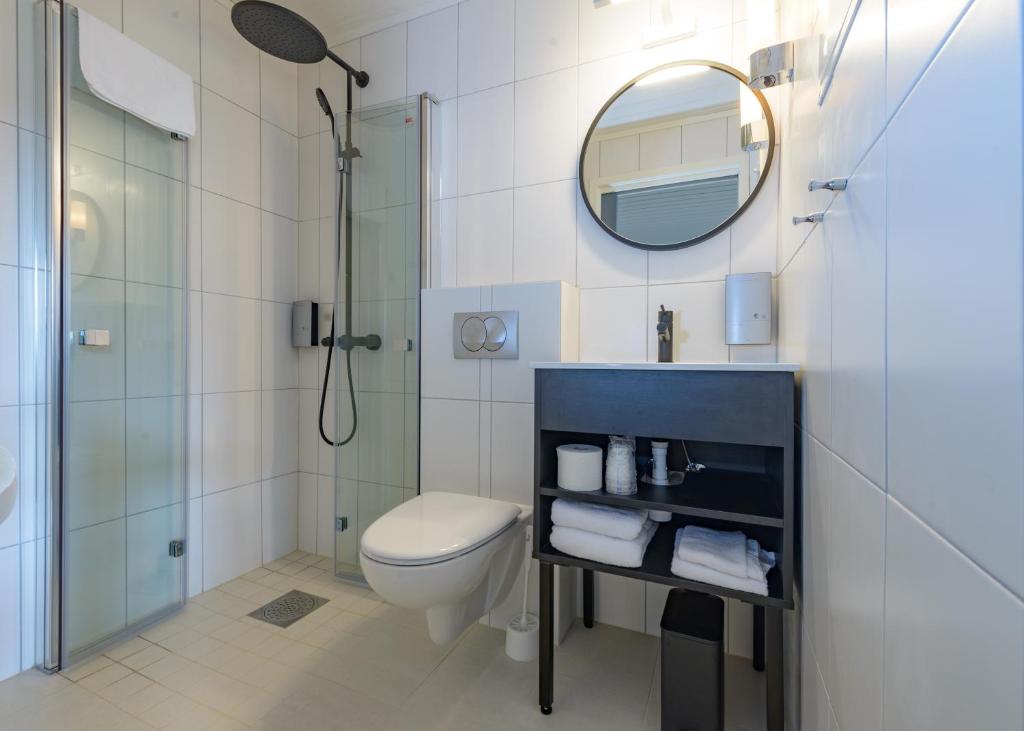 Koupelna v ubytování Grønnbuene Rorbu Hotel