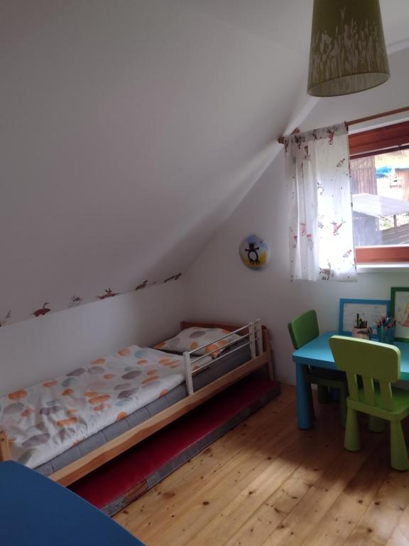 Postel nebo postele na pokoji v ubytování Chata Dvírka