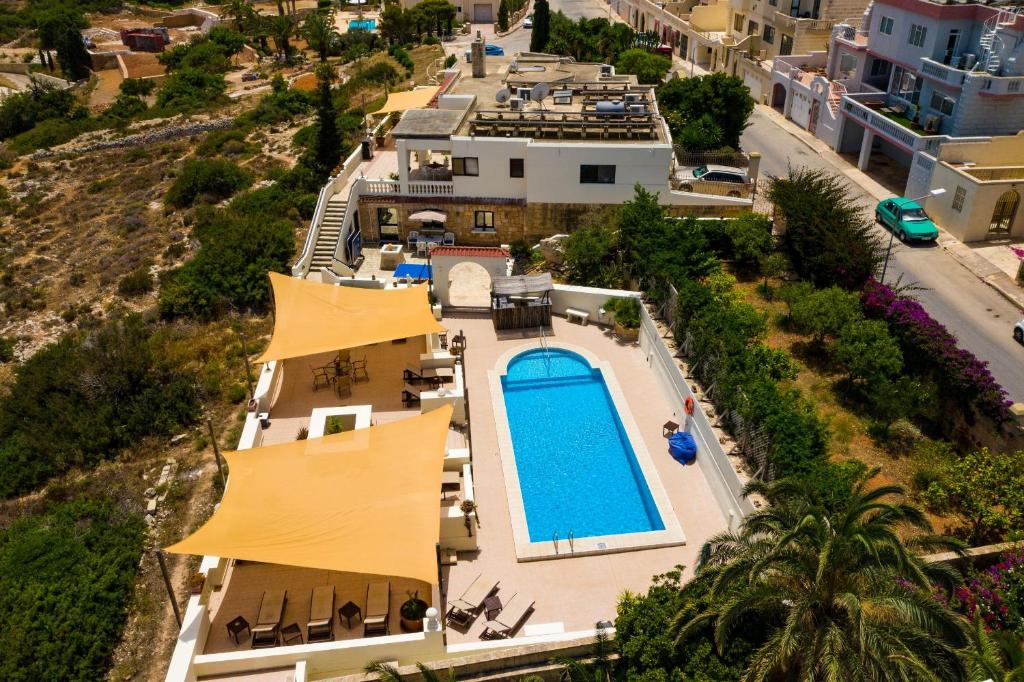 an aerial view of a house with a swimming pool at D View 4 You in Mellieħa