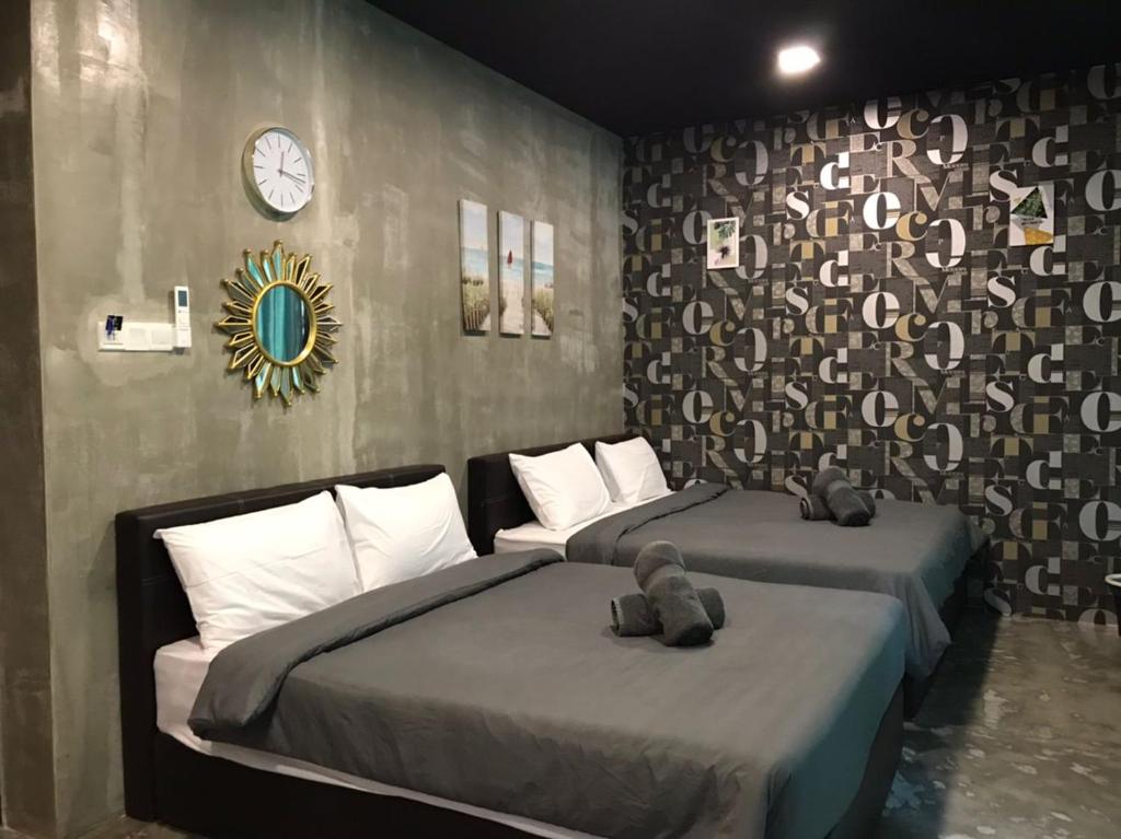 Postel nebo postele na pokoji v ubytování Hotel EC KIP Sentral KLIA 1 - KLIA 2