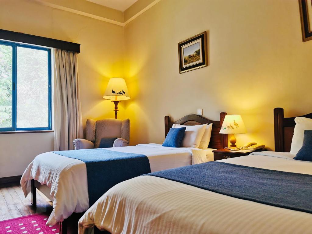 Postel nebo postele na pokoji v ubytování La Mada Hotel