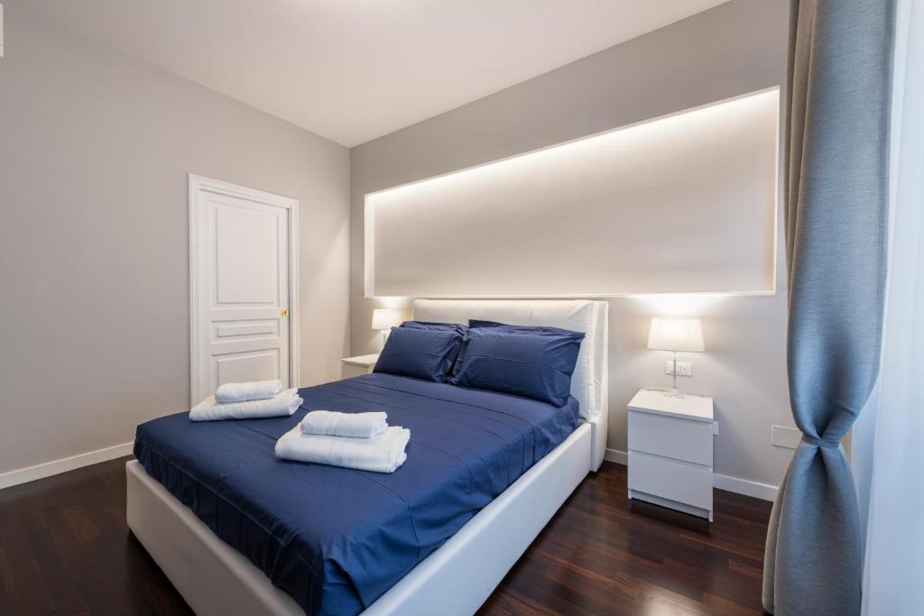 Łóżko lub łóżka w pokoju w obiekcie Ponte Vecchio Deluxe Apartments
