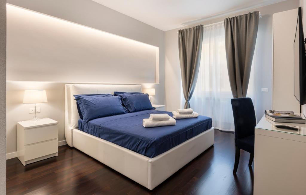 Łóżko lub łóżka w pokoju w obiekcie Ponte Vecchio Deluxe Apartments
