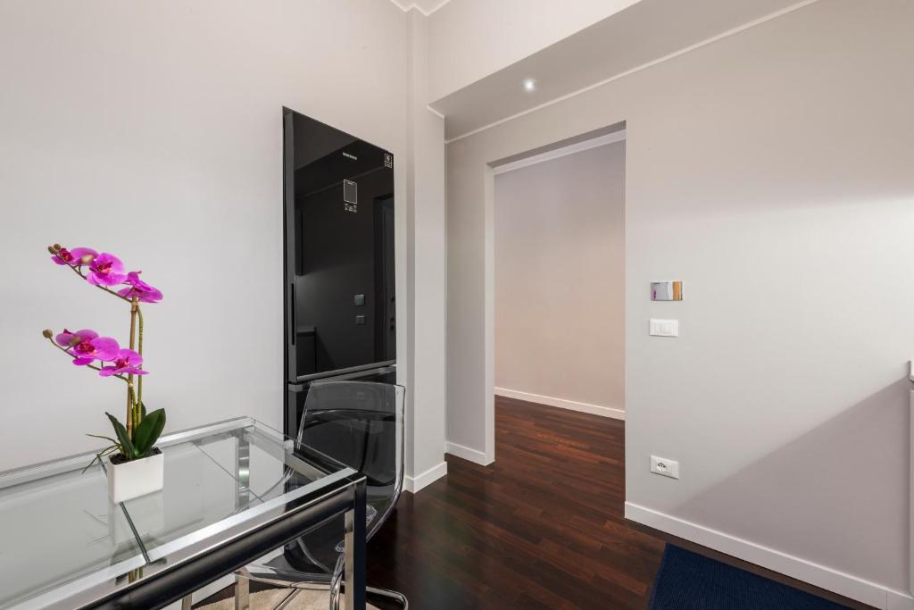 Telewizja i/lub zestaw kina domowego w obiekcie Ponte Vecchio Deluxe Apartments