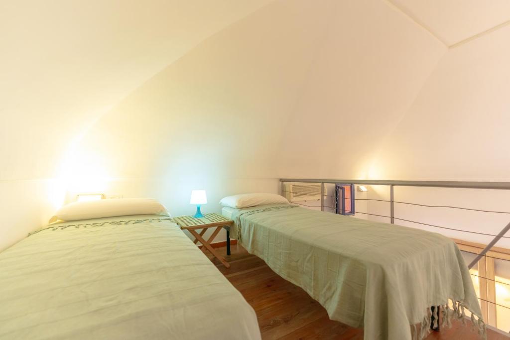 Postel nebo postele na pokoji v ubytování Casa Giovanni da Procida