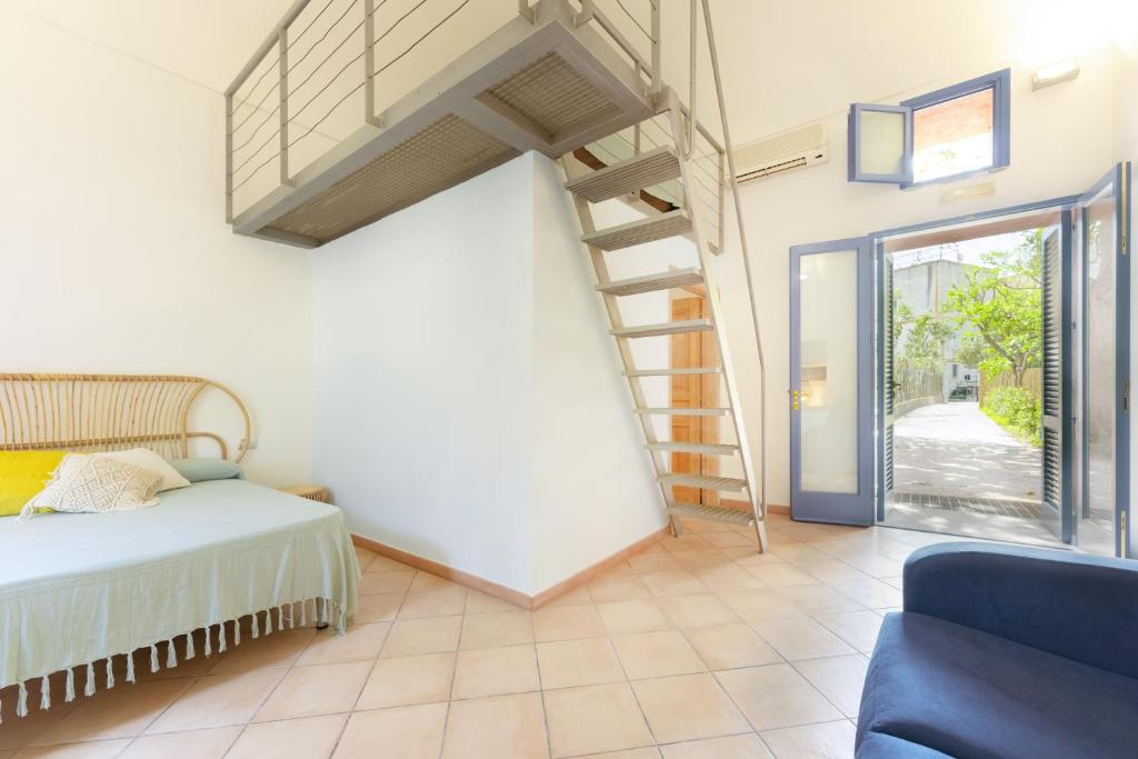 Postel nebo postele na pokoji v ubytování Casa Giovanni da Procida