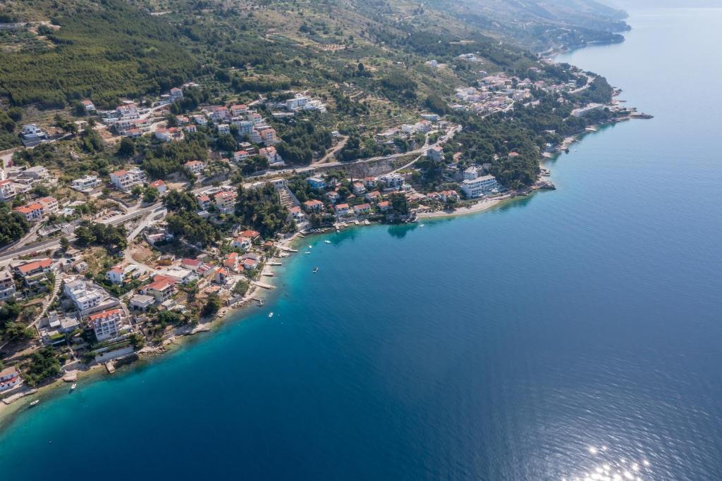 an island in the middle of a body of water at Apartments Drago Kovačić in Omiš