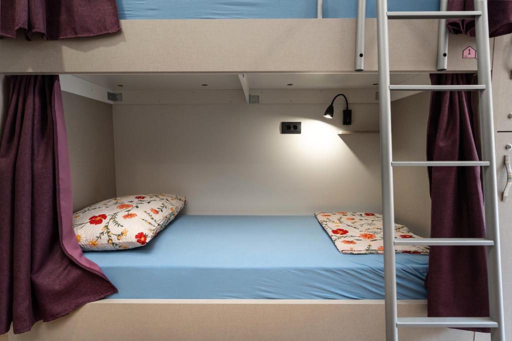 Postel nebo postele na pokoji v ubytování Hostel Antique