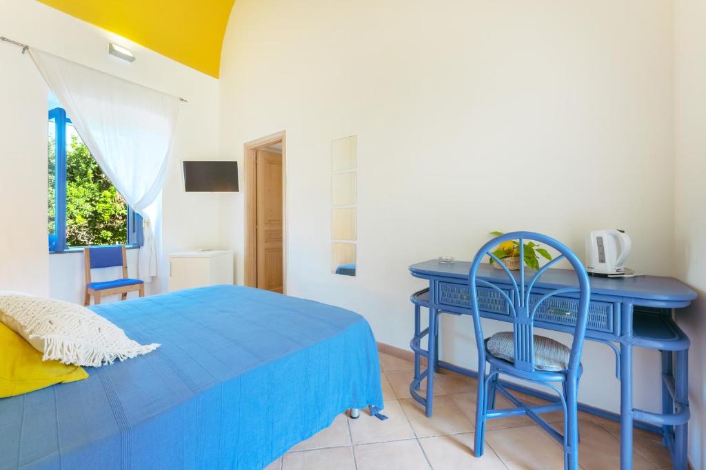 Postel nebo postele na pokoji v ubytování Casa Giovanni da Procida