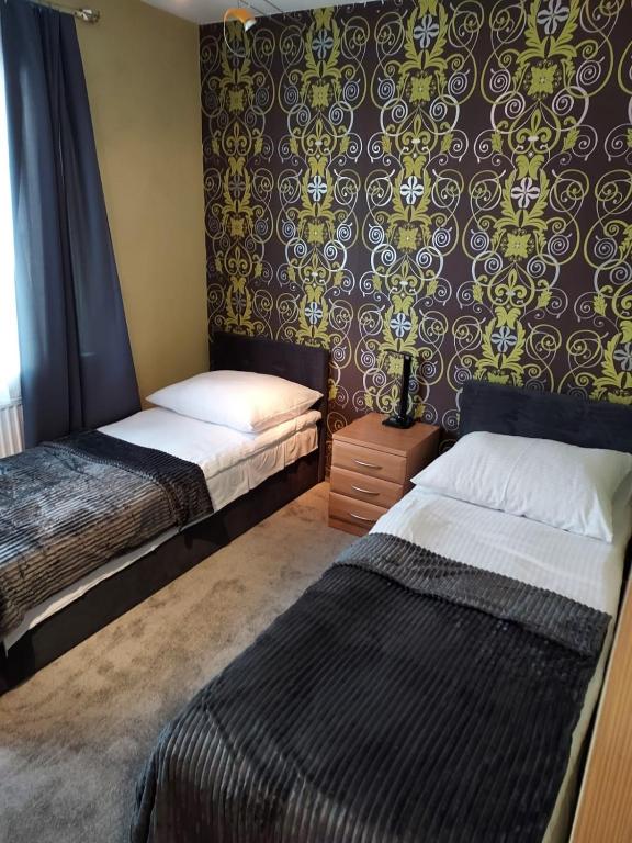 Postel nebo postele na pokoji v ubytování Prestige 2