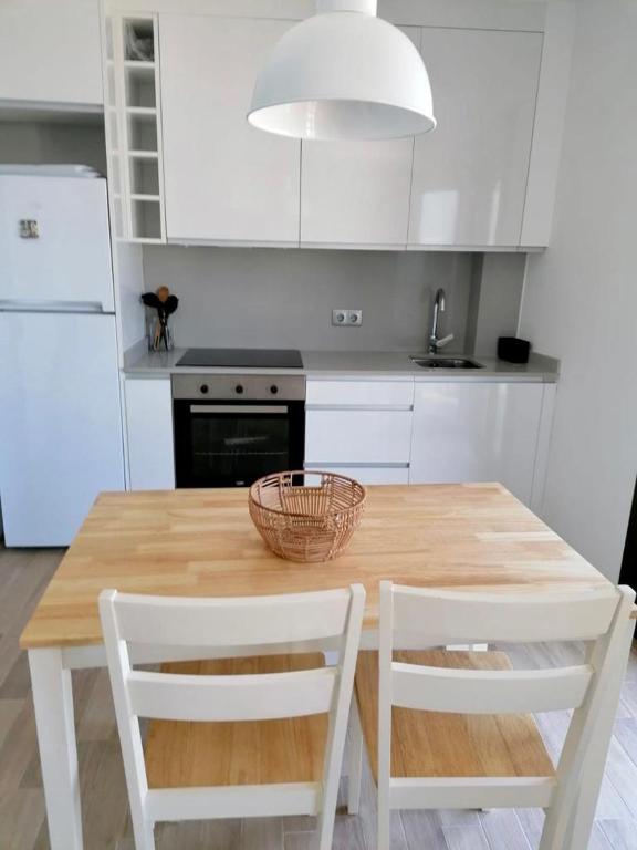 Kuchyň nebo kuchyňský kout v ubytování Apartamento frente al mar