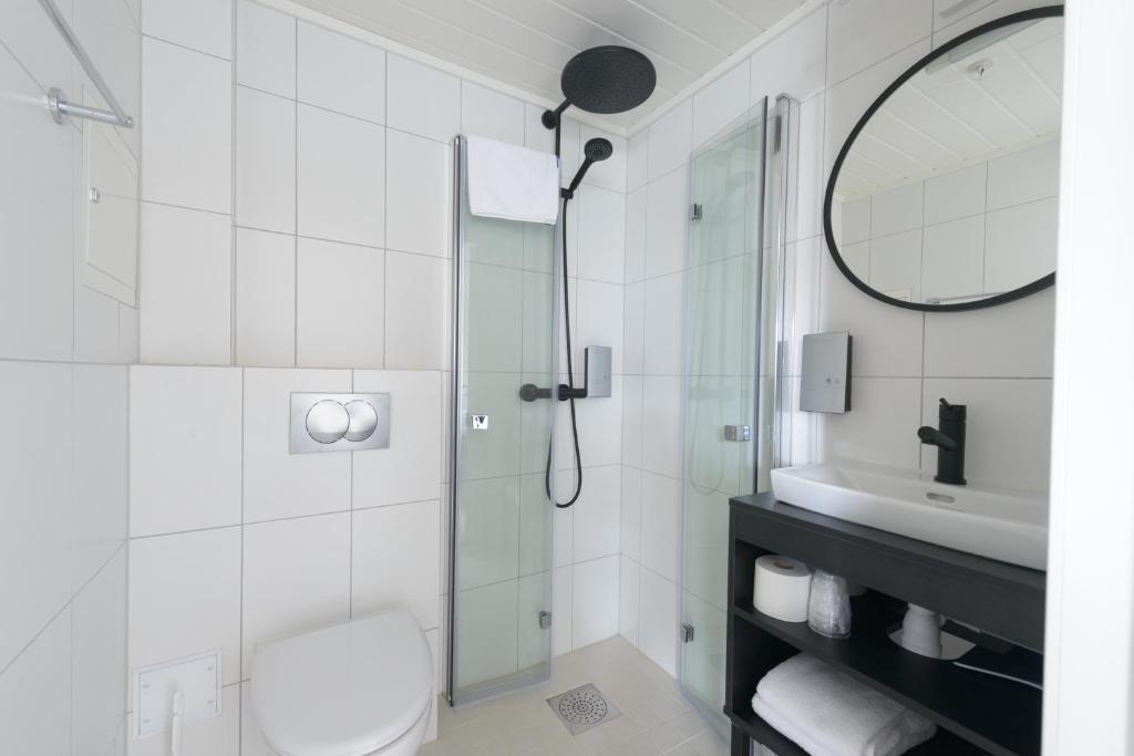 Koupelna v ubytování Grønnbuene Rorbu Hotel