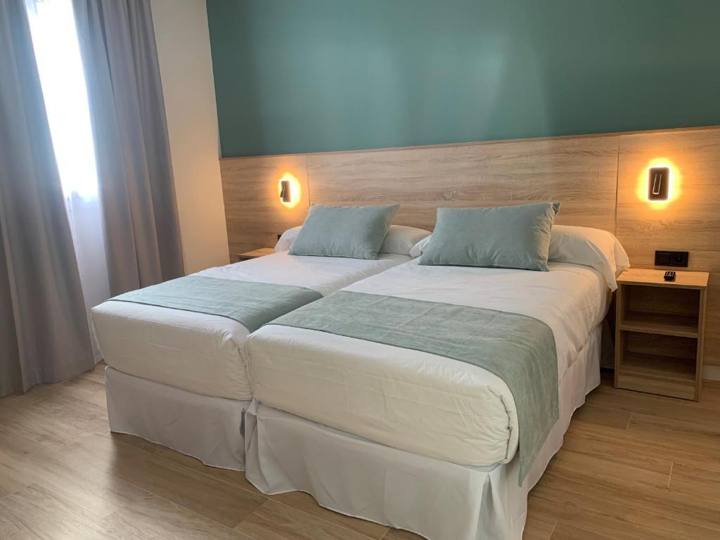 Posteľ alebo postele v izbe v ubytovaní Hotel Don Pepo