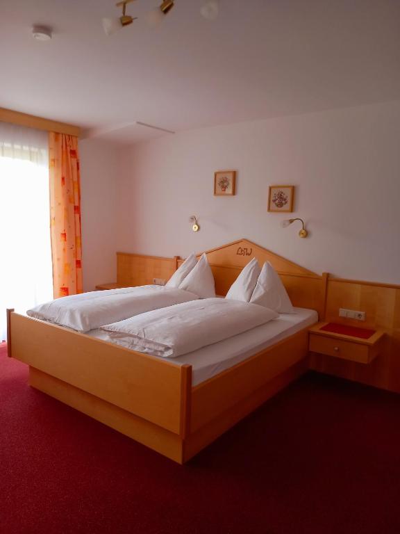 Postel nebo postele na pokoji v ubytování Landhaus Wieser