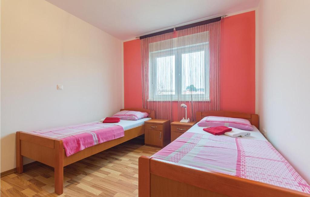 Łóżko lub łóżka w pokoju w obiekcie Apartment Medulin 04