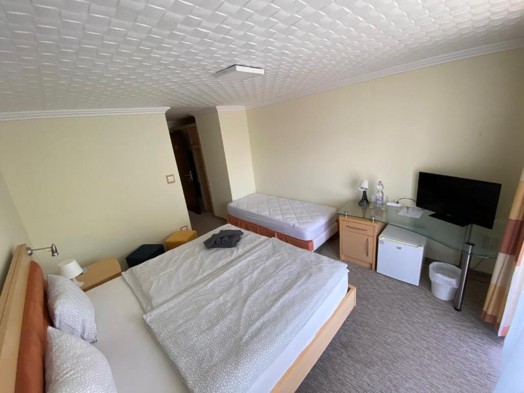 Postel nebo postele na pokoji v ubytování Solaris Hotel