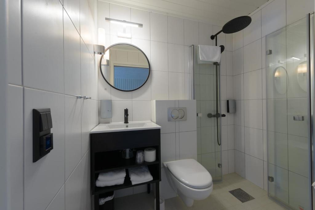Koupelna v ubytování Grønnbuene Rorbu Hotel