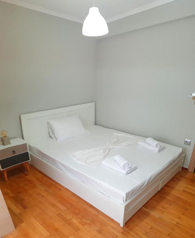 A bed or beds in a room at Panoramic Apartment
