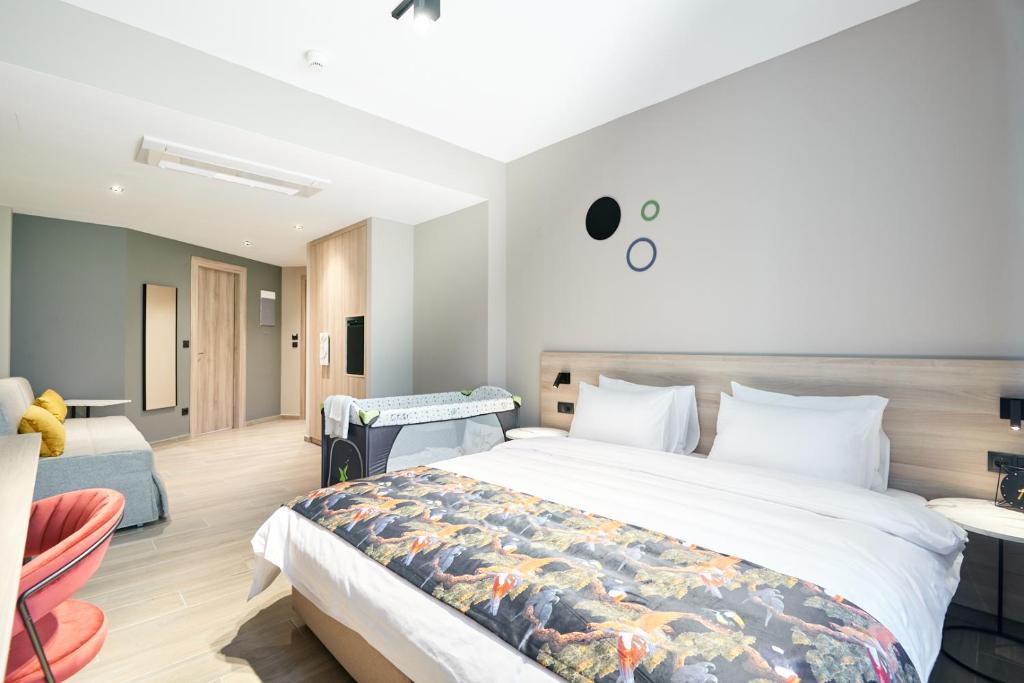 Postel nebo postele na pokoji v ubytování The Mavili urban stay