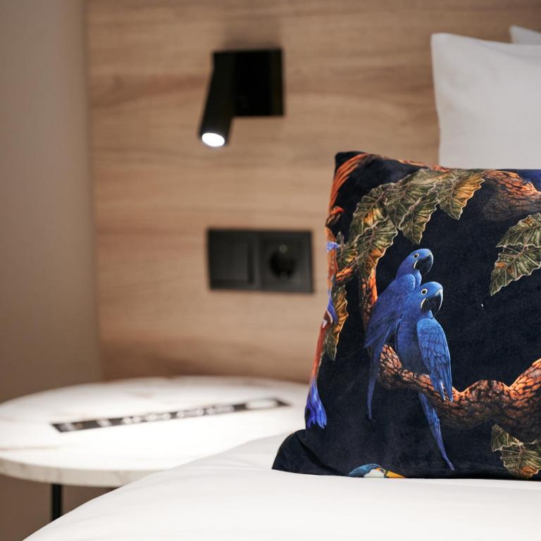Postel nebo postele na pokoji v ubytování The Mavili urban stay
