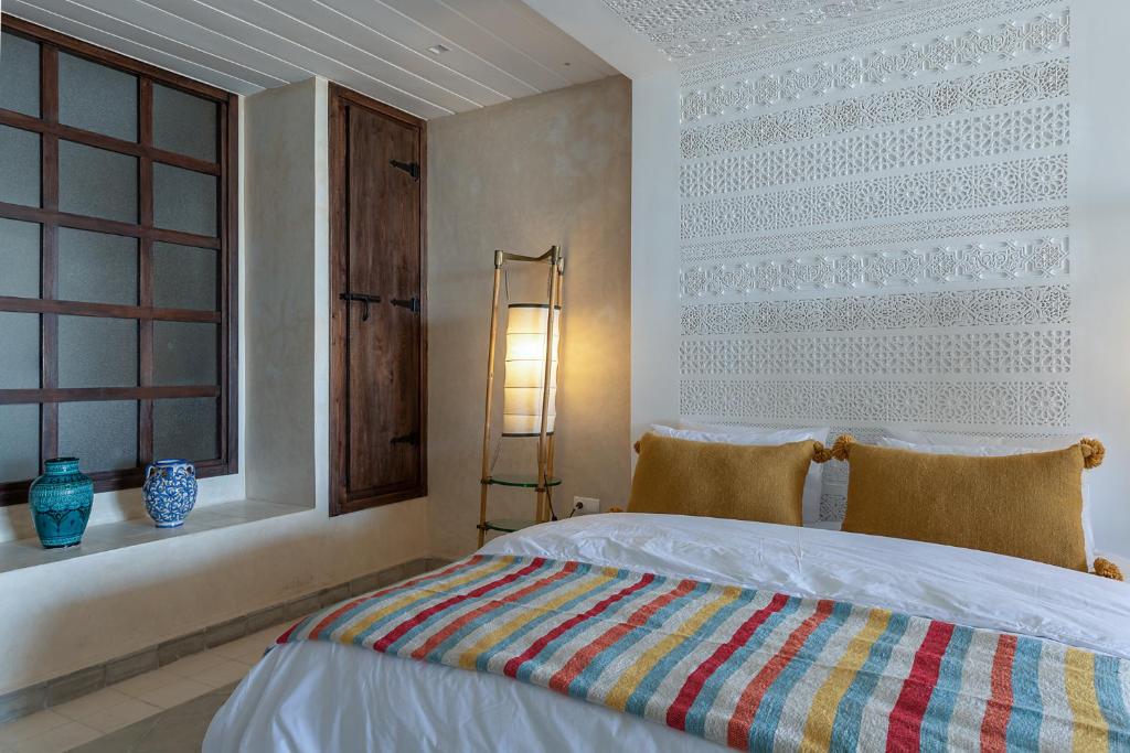 Postel nebo postele na pokoji v ubytování La Villa Joubert