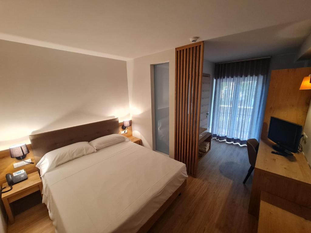 Postel nebo postele na pokoji v ubytování Hotel Ristorante Pennar
