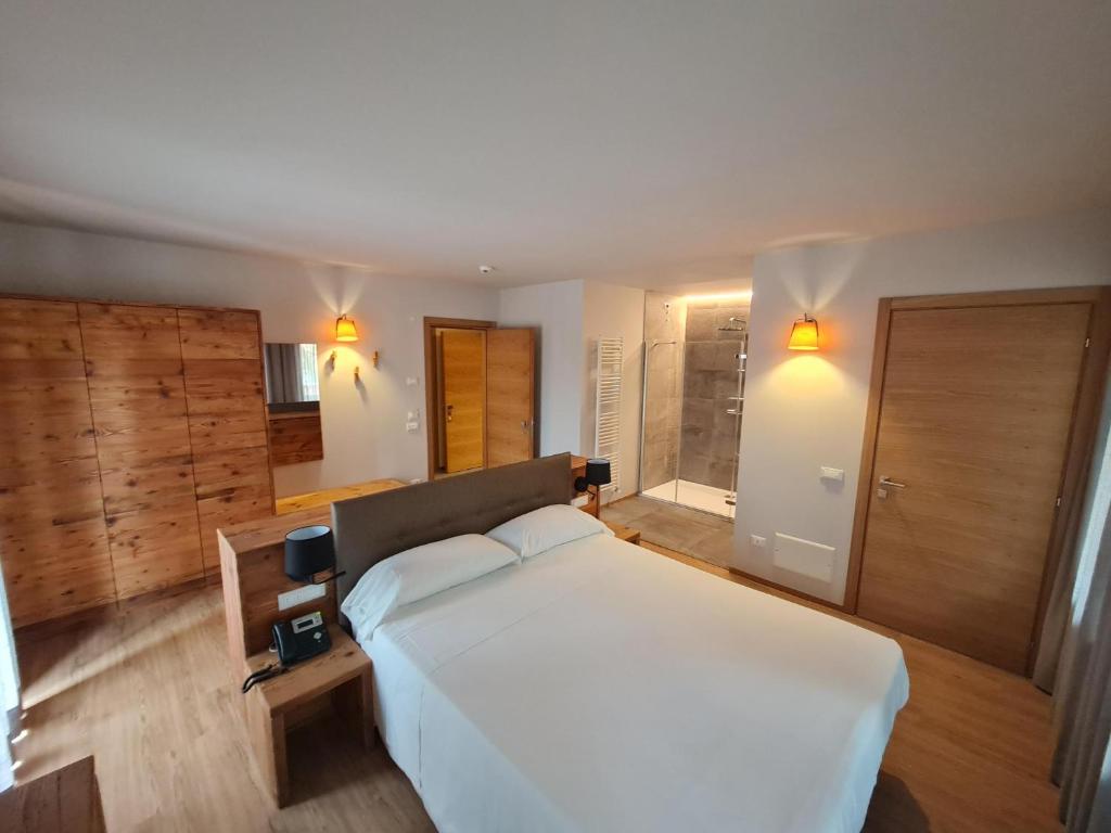 Postel nebo postele na pokoji v ubytování Hotel Ristorante Pennar