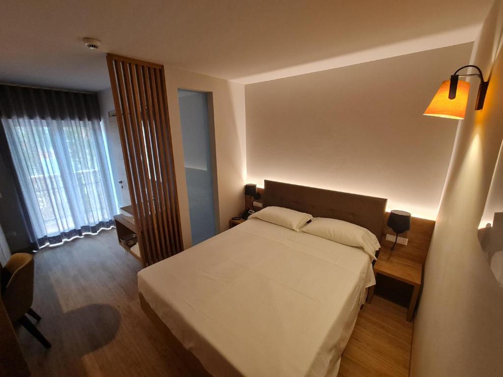 Postel nebo postele na pokoji v ubytování Hotel Ristorante Pennar