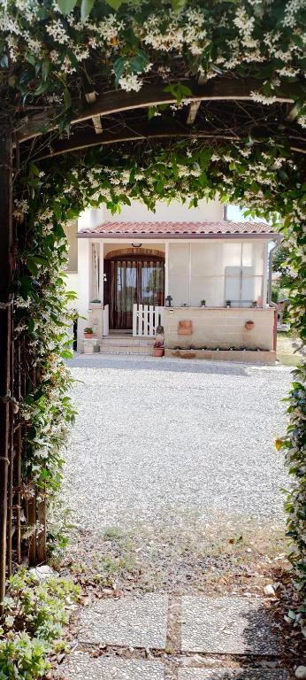 an archway leading to a house with a garage at Da Barbara & Simone in Collemezzano
