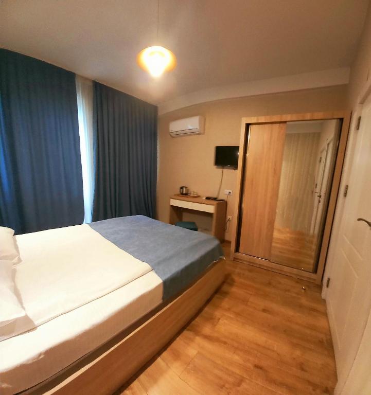 Postel nebo postele na pokoji v ubytování Hotel Lile