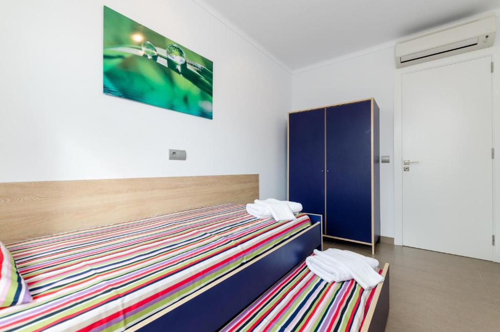 Postel nebo postele na pokoji v ubytování YourHouse Estel