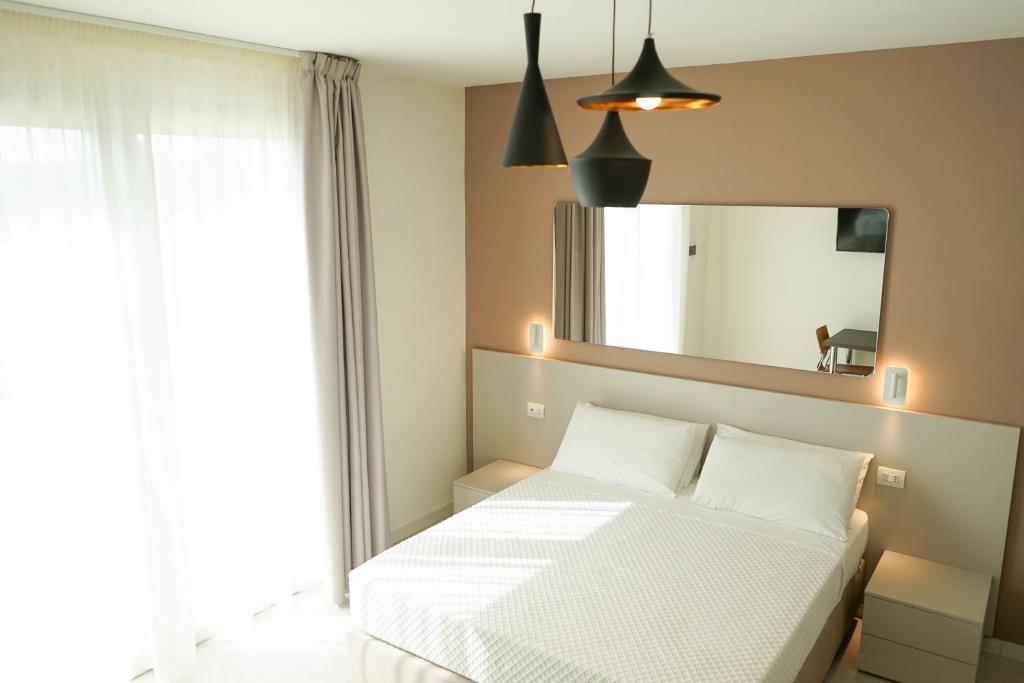 Postel nebo postele na pokoji v ubytování Ferrocino Resort
