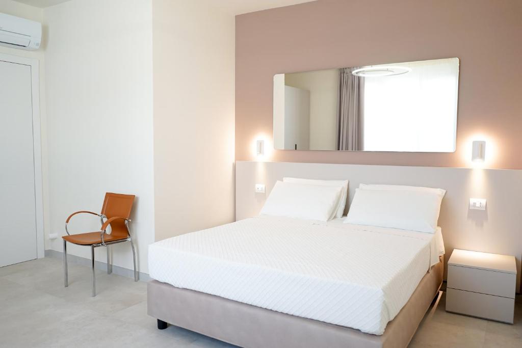 Postel nebo postele na pokoji v ubytování Ferrocino Resort