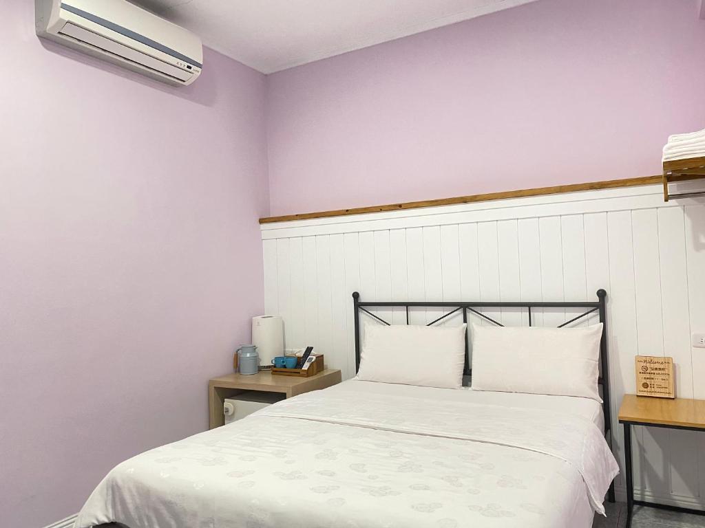 Postel nebo postele na pokoji v ubytování Mumu Inn