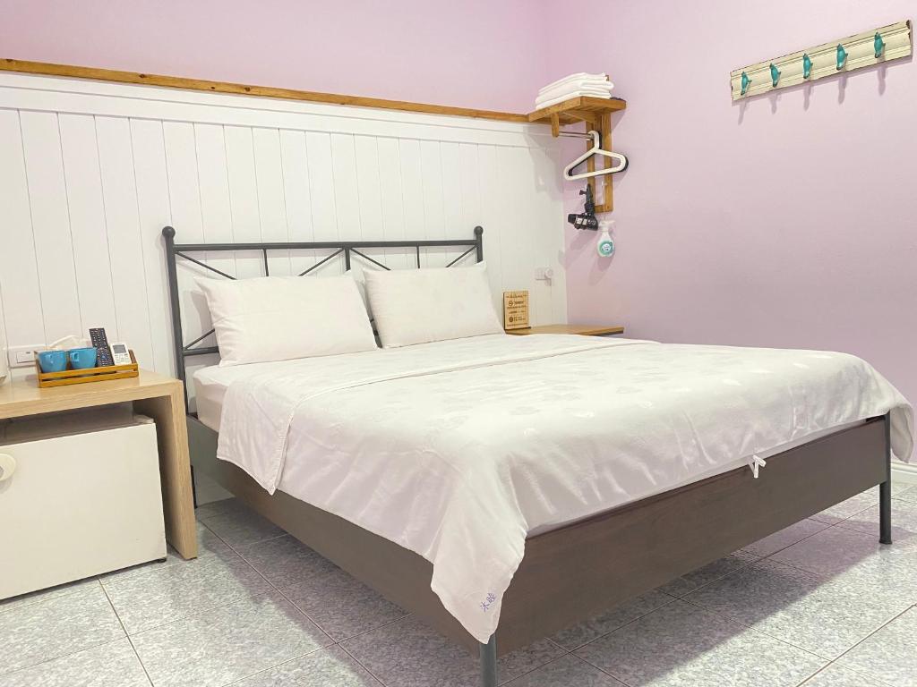 Postel nebo postele na pokoji v ubytování Mumu Inn