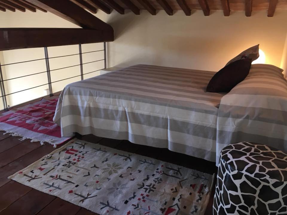 Łóżko lub łóżka w pokoju w obiekcie Agriturismo Le Casette Sul Lago