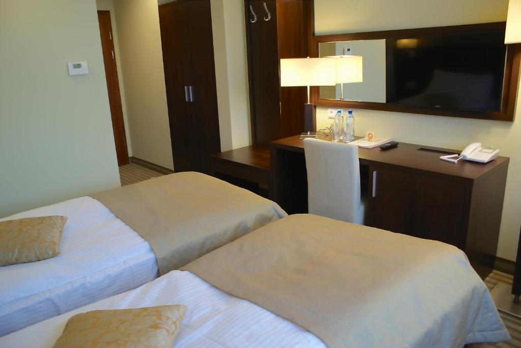 Łóżko lub łóżka w pokoju w obiekcie Hotel Lazur SPA & Conference